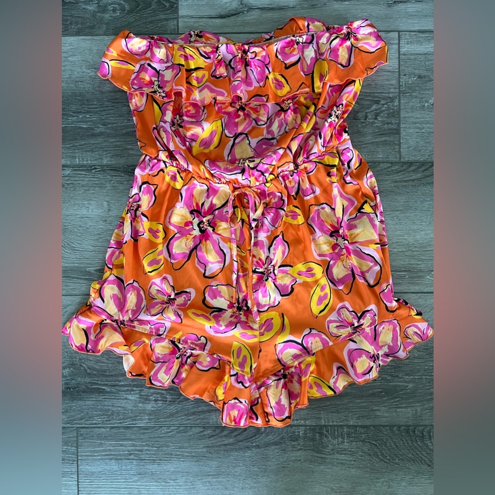 Super cute romper. Perfect for summer and vacation! Size L NEW TAGS ATTACHED